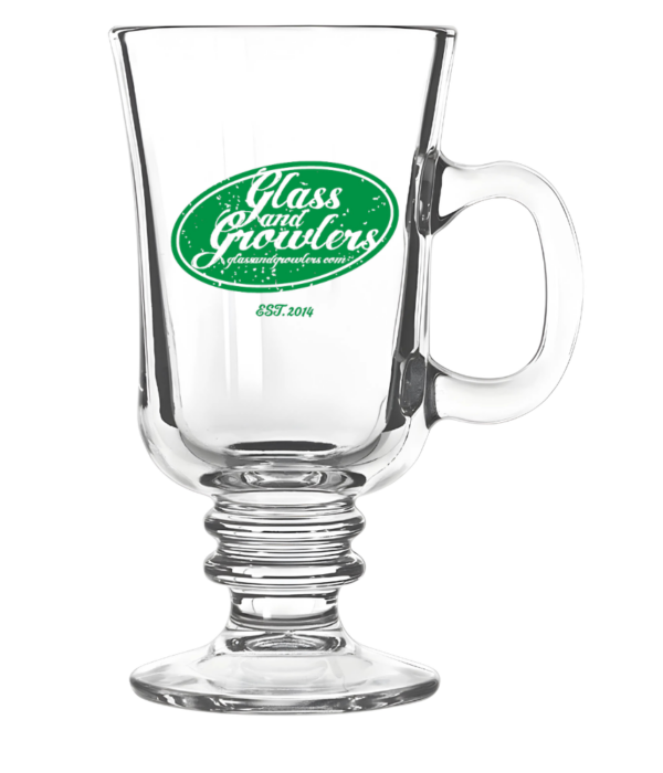 A clear glass Irish coffee mug with a ribbed stem and handle, featuring a green oval logo for 'Glass and Growlers' and 'EST. 2014' on the front.